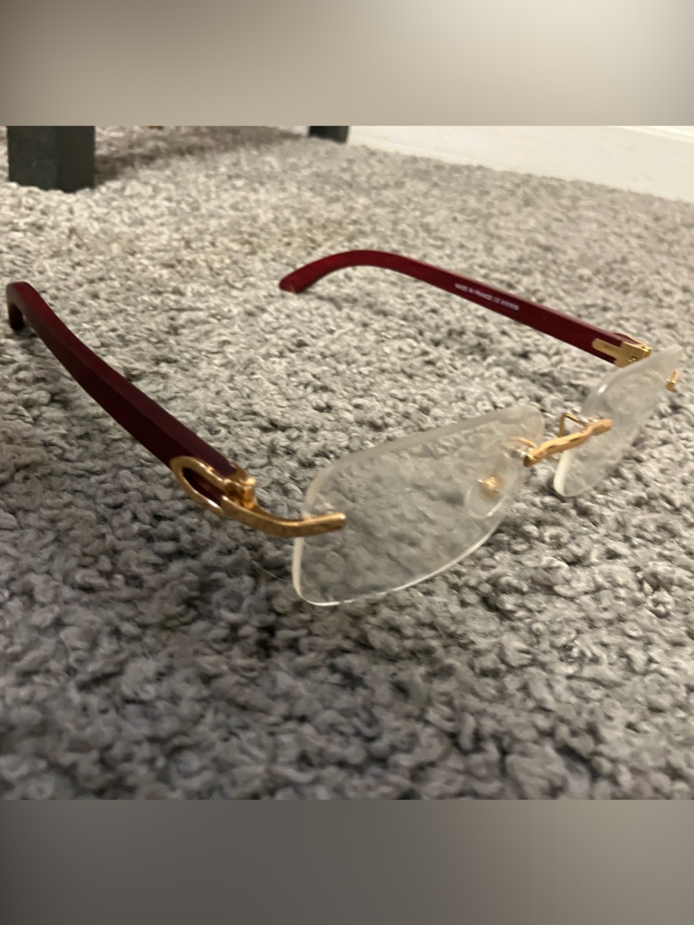 Cartier Men's Rimless Glasses with Burgundy Temples and Gold Hardware